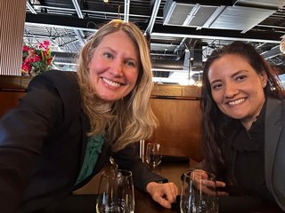 Warm moment between colleagues over dinner.
